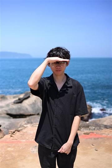 Yong Jun Mun standing by the coast